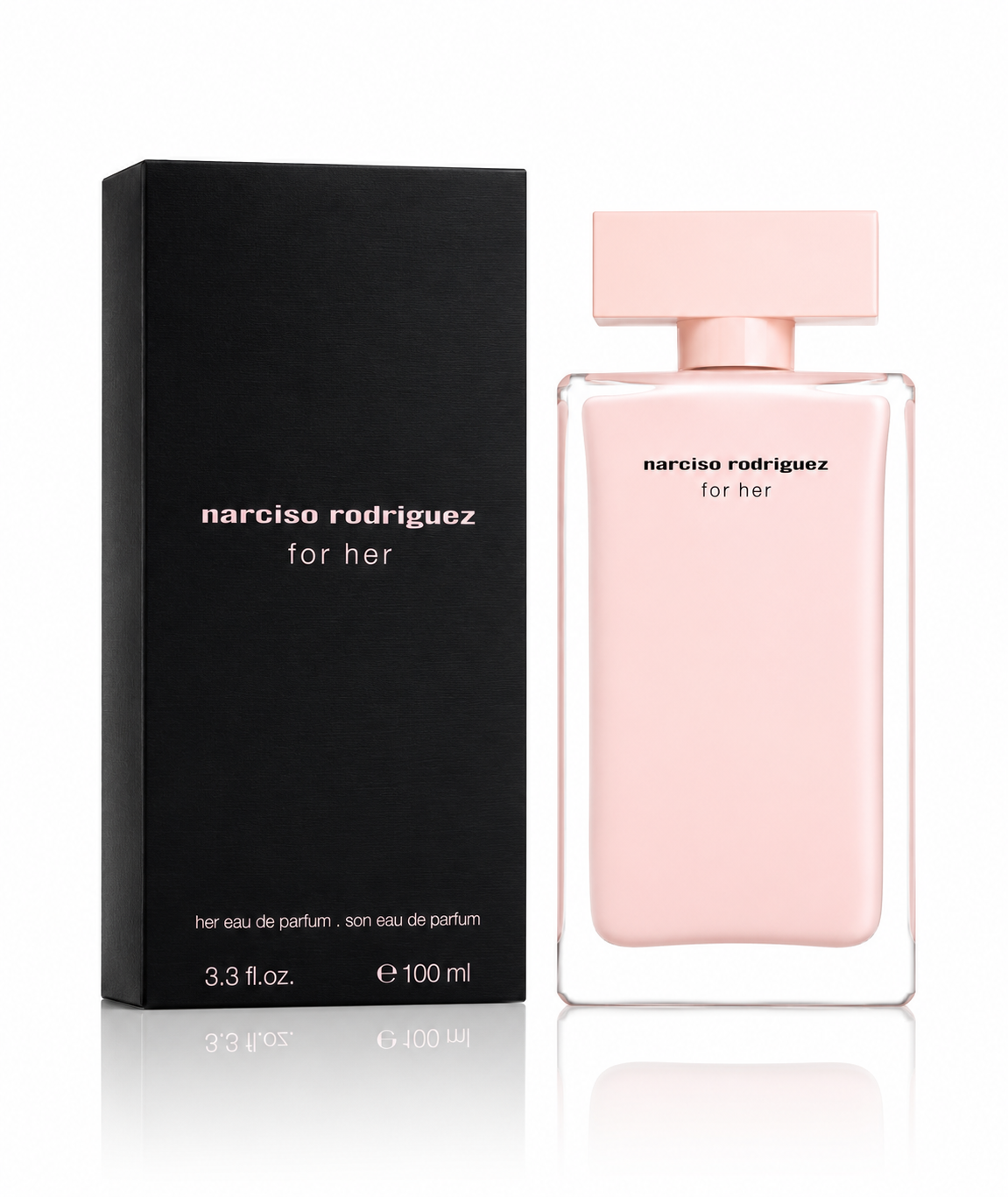 Narciso Rodriguez for her Eau de Parfum bottle in pale pink glass next to its black packaging box, on a white background with a soft reflection. 3.3 OZ EDP