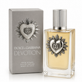 Dolce & Gabbana Devotion Pour Homme Eau de Parfum bottle with its grey packaging box, featuring a silver heart emblem on a white background.