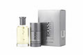 Hugo Boss perfume bottle and travel edition packaging on a white background