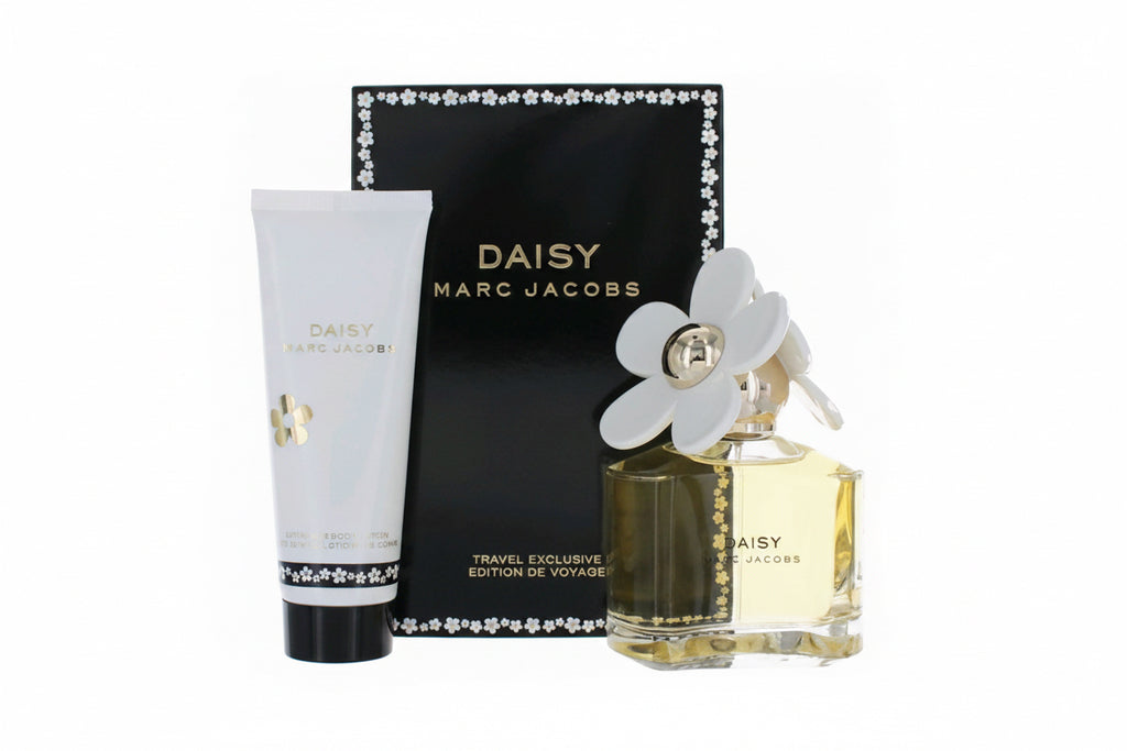 Marc Jacobs Daisy perfume set with bottle, lotion, and packaging on a white background. 3.3 EDT/ 2.5 OZ BL